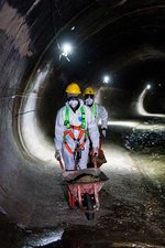 Workers carry debris 